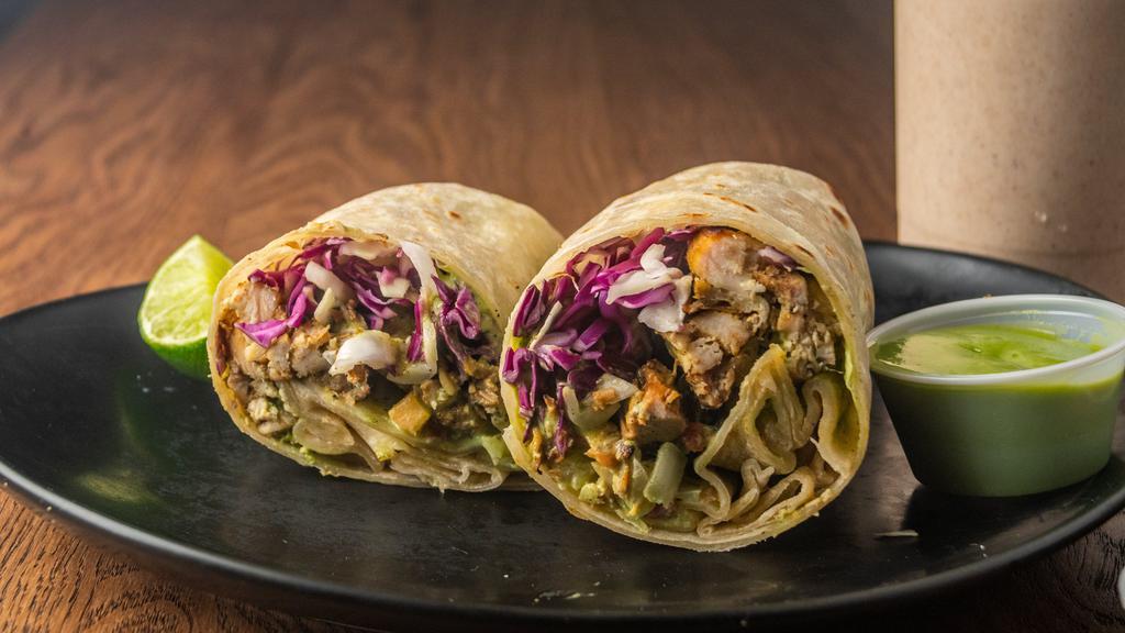 The Sorority Burrito · Grilled chicken, cabbage, pico de gallo, guacamole, our cilantro lime dressing light, and fresh burrito.