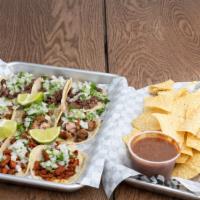 The Party House · 9 street tacos box, 3 Asada, 3 pastors, 3 chicken with cilantro, onions, chips, and salsa to...