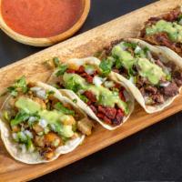 Street Tacos · choice of protein on a corn tortilla topped with cilantro and onions and of course choice of...