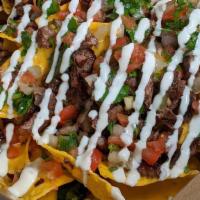 Frat House · A mess that looks and smells good. Loaded nachos with choice of protein, topped with pico de...