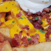 King Fries (Large) · Fresh cut fries loaded with cheese sauce, chopped bacon, sour cream and chives.