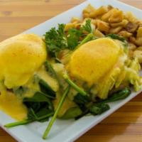 Farmers Market Benedict · 2 poached eggs, spinach, tomato, avocado, and hollandaise sauce, on english muffin with side...