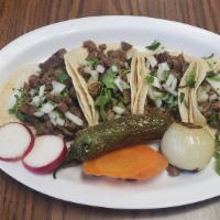 Tacos (4) · Your choice of meat on 4 tacos. Topped with onions & cilantro