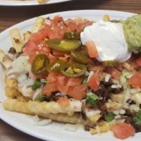 Asada Fries · French fries with cheese, onions, your choice of meat, cilantro, onions, jalapeños, sour cre...