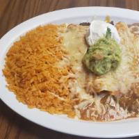 Enchiladas Especiales  · 2 enchiladas with your choice of meat coved in red sauce & cheese. includes a side of Rice a...