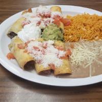 Taquitos Con Guacamole  · 3 rolled taquitos with your choice of meat. includes Rice and beans.
