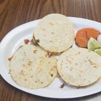 Mulitas (3) · Mini quesadilla on a corn tortilla with your choice of meat, onions, cilantro, & avocado