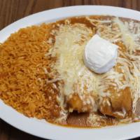 Combo Tamales · Chicken or Pork tamales covered in red sauce & cheese. includes rice and beans.