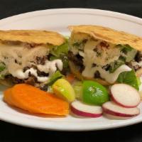 Gorditas (2) · 2 thick tortillas filled with refried beans, your choice of meat, onions, cilantro, salsa, l...