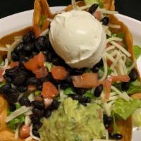 Veggie Taco Salad · Hardshell bowl with refried beans, rice, lettuce, sour cream, guacamole, & cheese