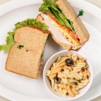 Turkey · Oven smoked turkey, Colby jack cheese, green leaf lettuce, fresh tomato and mayo on your cho...
