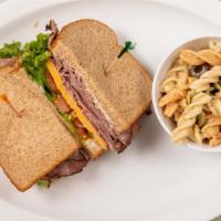 Roast Beef · Oven roasted bottom beef round, cheddar cheese, green leaf lettuce, fresh tomato and creamy ...