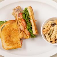 Chipotle Turkey Melt · Grilled oven smoked turkey, melted cheddar cheese, green leaf lettuce, tomato, mayo and crea...