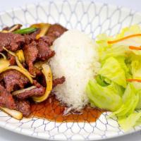 Mongolian Beef · Marinated slices of tenderized beef stir-fried with onions and green onions.