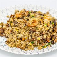 House Fried Rice · Stir fried rice with chicken, beef, pork and shrimp.