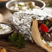 Falafel Sandwich · A middle eastern vegetarian twist. Served with pita bread with tomatoes, onions and tzatziki...