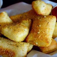 Passion Bread · Tasty bread tossed with garlic butter, parmesan cheese and Italian spices. Served with a sid...