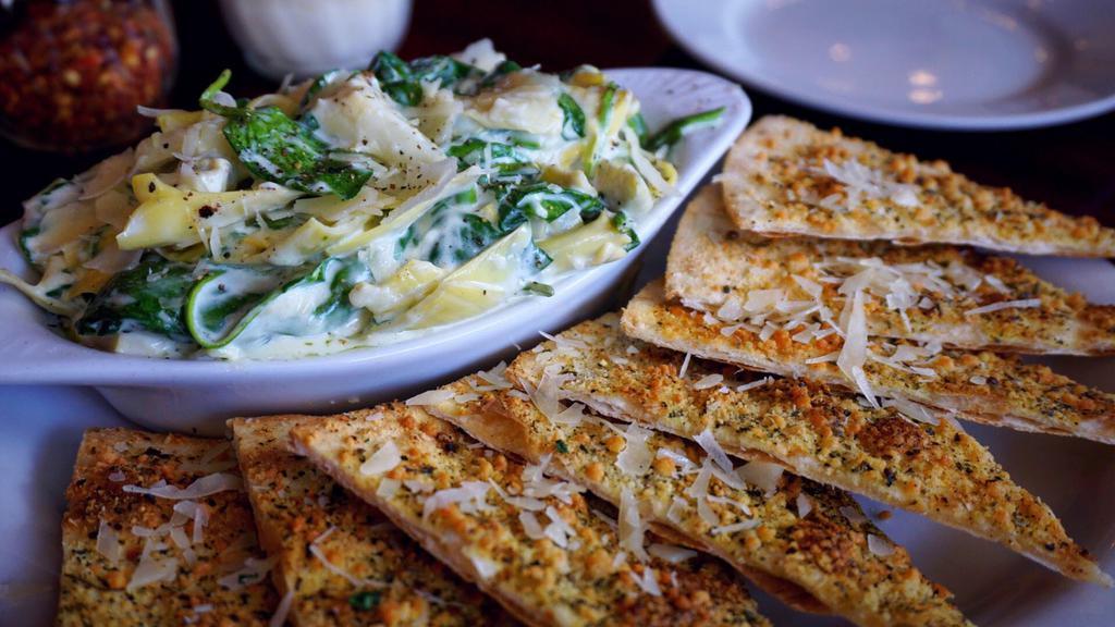 Artichoke Spinach Dip · Served with garlic buttered pizza bread.