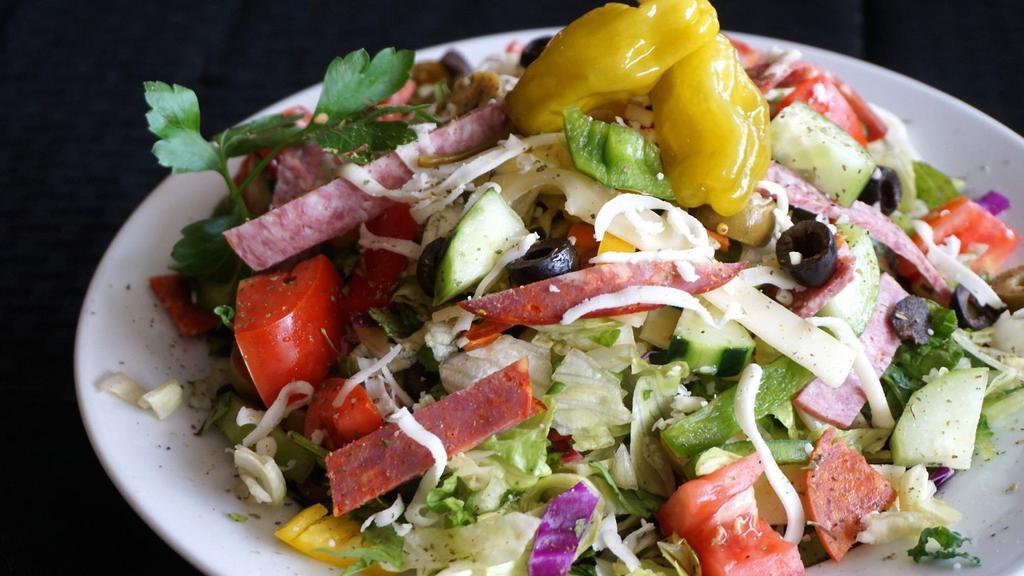 Small Antipasto Salad · Capicola ham, Genoa salami, pepperoni, roma tomatoes, cucumbers, mixed bell peppers, pepperoncini, black olives, green olives, swiss, mozzarella - tossed with streets Italian dressing.