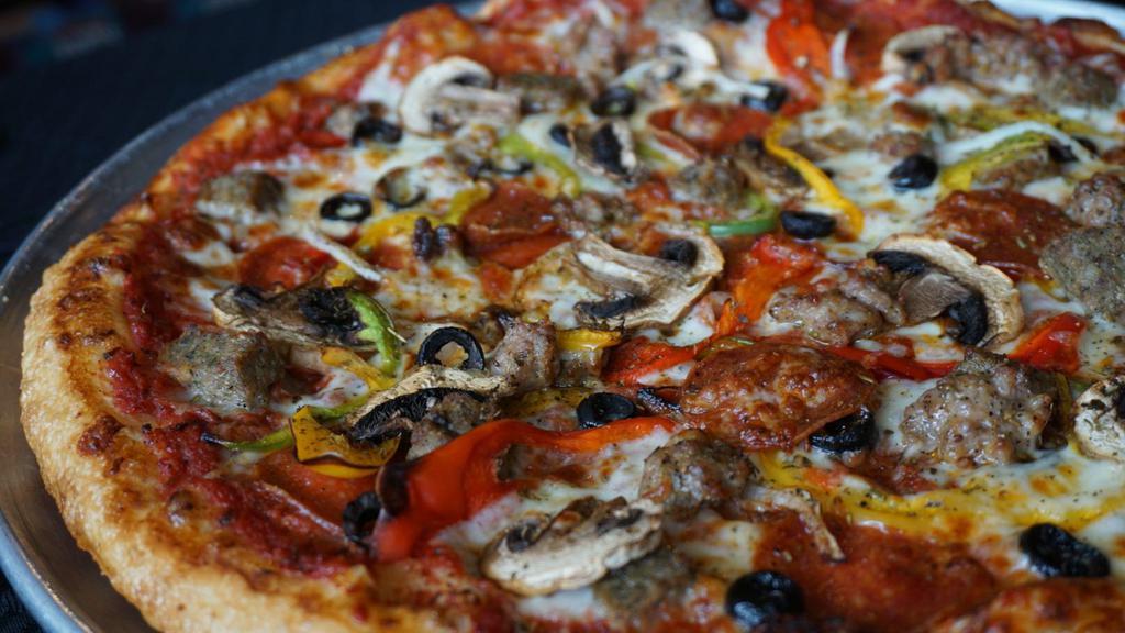 New York Combo · Pepperoni, Italian sausage, meatballs, mixed bell peppers, mushrooms, onions, black olives.