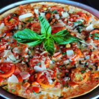 Classic Margherita Pizza · Garlic butter, Roma tomatoes, onions, fresh basil, roasted garlic, pecorino, balsamic vinegar.