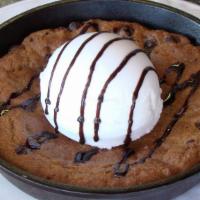 Passion Cookie · Chocolate chip cookie, served with vanilla ice cream.