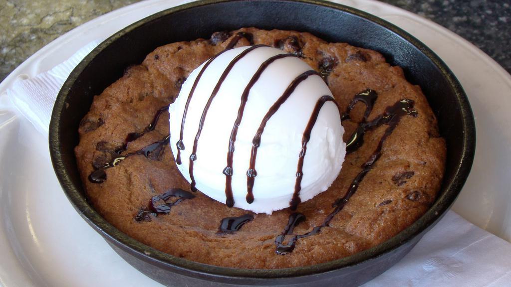 Passion Cookie · Chocolate chip cookie, served with vanilla ice cream.