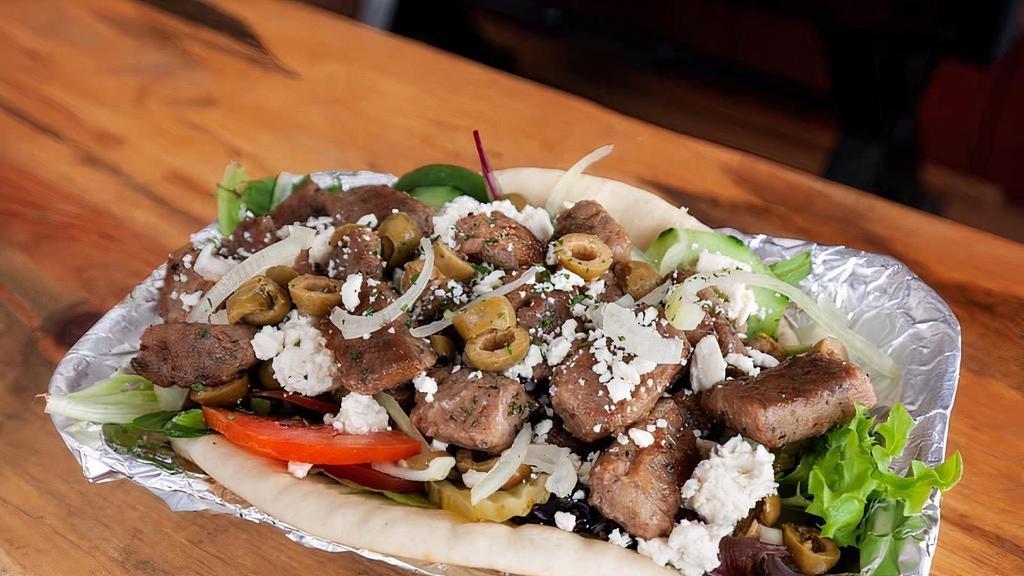 Lamb (Pita Wrap ) · Sliced mix of seasoned lamb and beef roasted on a vertical spit-rotisserie.