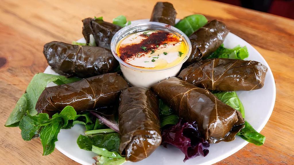 Side Of Grape-Leaves · 8 stuffed pieces served with hummus .