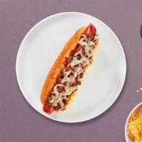 Angel Ranch Bacon Vegan Dog · Vegan hot dog topped with vegan bacon bits and vegan ranch on a toasted hot dog bun.