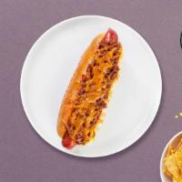 Bacon Bro Vegan Dog · Vegan hot dog topped with vegan chili, vegan bacon, relish, mustard, and vegan mayo  on a to...