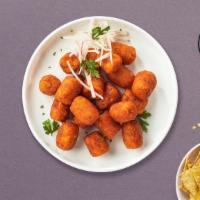 Sweety Tots · Shredded sweet potatoes formed into tots, battered, and fried until golden brown. Served wit...