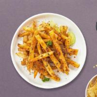 Spiced Up Fries · Idaho potato fries cooked until golden brown and garnished with spicy seasoning.