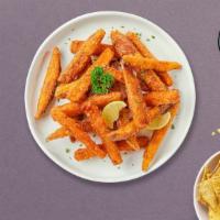 Sweet Stud Fries · Thick-cut sweet potato wedges fried until golden brown