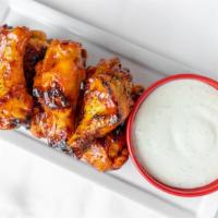 Wings · 'Zano's own sweet-spicy, traditional BBQ,  firehouse hot, or Franks & Butter served with ran...