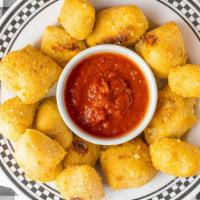 Garlic Bread Bites · Yummy soft dough balls tossed in butter, garlic, Parmesan, &  sea salt. Served with house ma...