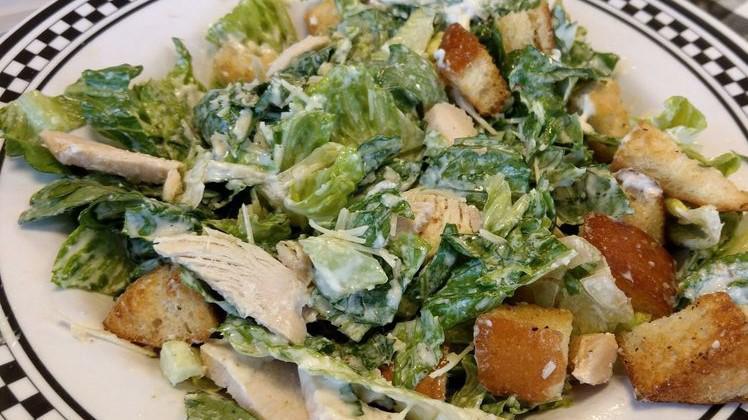 Caesar · Romaine, parmesan, croutons all tossed with our scratch made Caesar dressing.