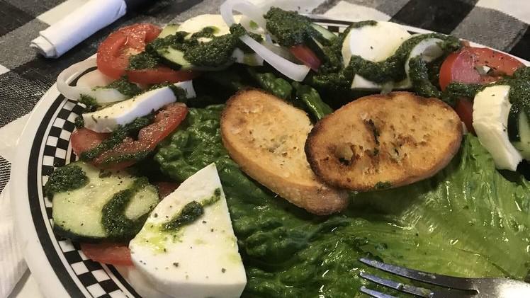 Caprese · Marinated tomato, romaine, and fresh mozzarella. With parmesan toasts &  a side of balsamic dressing.