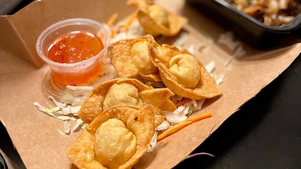 Crab Cream Puff · Crab and cream cheese wrapped in wonton skin then deep-fried and served with our special house sauce. (Five pieces).