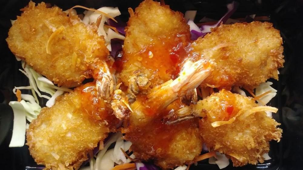Coconut Shrimp · Tiger shrimp dipped in coconut batter and shredded coconut served with Thai sweet chili sauce. Crispy & delicious.