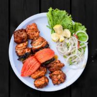 Marinated Chicken Kabab · Chicken thighs and chicken cubes marinated in yogurt along with lime juice and then grilled ...