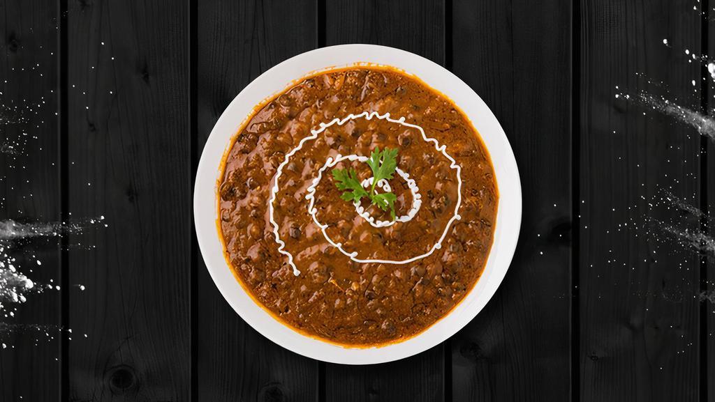 Creamy Black Lentils · Black lentils slow cooked till tender and tempered with Indian spices and finished with fresh cream.