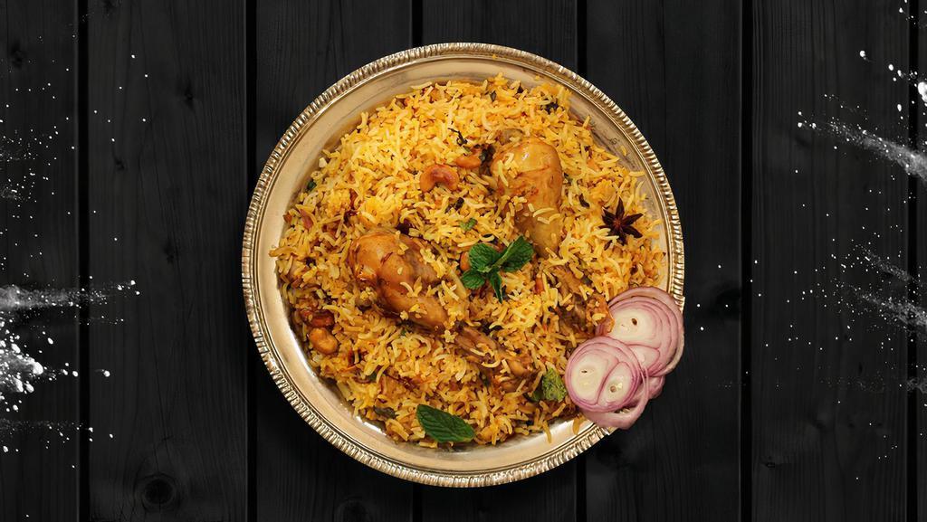 Chunky Chicken Biryani · Long grained rice flavored with fragrant spices flavored along with saffron and layered with chicken and cooked with biryani masala gravy.