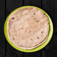 Roti · Whole wheat flat bread baked to perfection in an Indian clay oven.