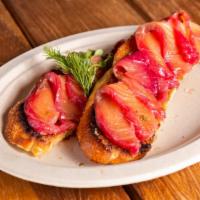 Pinky Salmon Toast · beet cured salmon*, roasted chili aioli, pickled red onion, caper, sourdough

*Consuming raw...