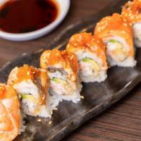 Fire Breathing Dragon* · Crab, avocado, tempura onions, and spicy sauce, covered with cold smoked salmon, eel, ebi, a...
