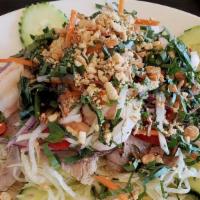 Shrimp & Pork Salad (Goi Tom Thit) · Serving with iceberg lettuce, basil, carrot, bell pepper, onion, with steamed shrimp and por...