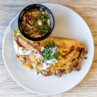 Quesabirria Tacos · Slow cooked short rib, Oaxaca cheese, cilantro, onions, consume.