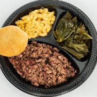 Chopped Brisket Plate · Mesquite smoked chopped brisket from the point with outside bark mixed into. Includes two si...