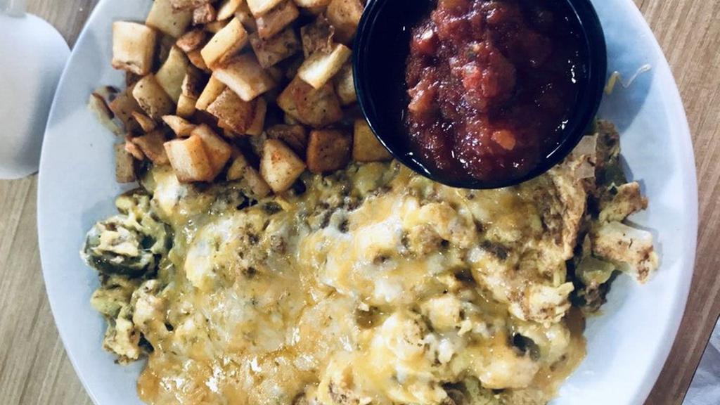 Southwest Scramble · Three Eggs scrambled with Chorizo, Green Chiles, Jalapenos, Onions, and Jack & Cheddar Cheese Served with a side of Salsa
